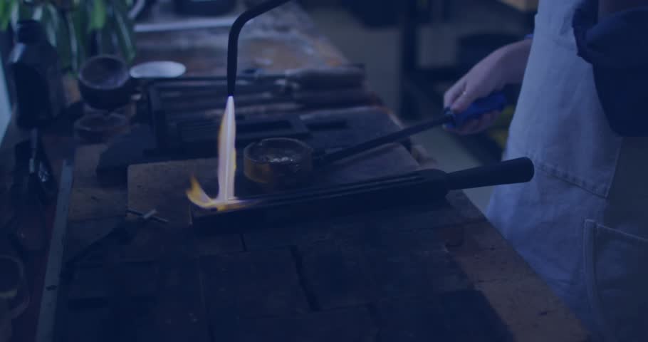 Woman igniting torch on tray, sweeping and summoning social media icons counting rising engagement. Craftsmanship, metallurgy, glowing, workshop, artisan, innovation, creativity