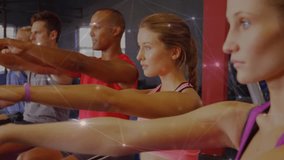 Camera panning showing workout group holding arms out while glowing network tracking performance. Fitness, group workout, body movement, modern technology, exercise class, healthy lifestyle, physical - Powered by Shutterstock - Get 15% off with code: PIKWIZARD15