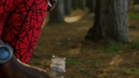 Fitness runner twisting cap and activating digital globe while sipping water for hydration on trail. Outdoor, adventure, wellness, technology, fitness, hydration, nature - Powered by Shutterstock - Get 15% off with code: PIKWIZARD15