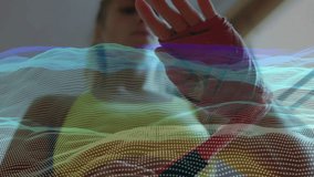 Female athlete pulling cotton wrap to chin, wrapping wrist for workout with digital mesh undulating. Athlete, sportswear, training, fitness, animation, digital, technology - Powered by Shutterstock - Get 15% off with code: PIKWIZARD15