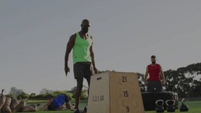 Instructor counting down, box jumping during fitness class with animated charts tracking progress. Outdoor, fitness, training, strength, agility, motivation, sportswear - Powered by Shutterstock - Get 15% off with code: PIKWIZARD15