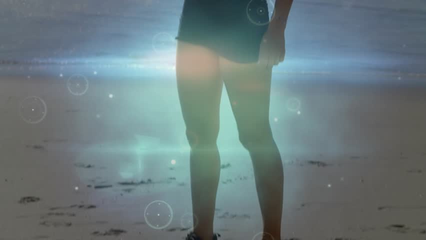 Camera zooming fitness model raising arm shielding eyes as digital overlays intensifying silhouette. Fitness, silhouette, digital art, abstract, activewear, wellness, summer - Powered by Shutterstock - Get 15% off with code: PIKWIZARD15