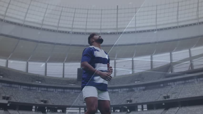 Male athlete gripping rugby ball activating hologram overlay tossing engaging sports tech interface. Athlete, stadium, digital graphics, futuristic, sports, technology, innovation - Powered by Shutterstock - Get 15% off with code: PIKWIZARD15