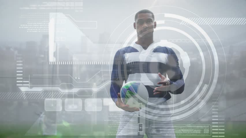 Male athlete on field shifting rugby ball grip adjusting stance while tracking metrics with HUD. Athlete, stadium, sportswear, technology, fitness, performance, training - Powered by Shutterstock - Get 15% off with code: PIKWIZARD15