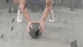 Athlete performing push ups by pressing into medicine ball in fitness garage for strength training. Fitness, strength, training, workout, industrial, muscular, equipment - Powered by Shutterstock - Get 15% off with code: PIKWIZARD15