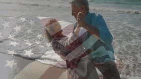 Senior couple holding hands dancing with waves and American flag overlay moving celebrating travel. Romance, celebration, beachlife, leisure, outdoor, vibrant, companionship - Powered by Shutterstock - Get 15% off with code: PIKWIZARD15