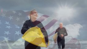 Sports showing woman entering surf with yellow boards, man following under faded flag or sun overlay. Retirement, adventure, leisure, outdoor, activity, vibrant, positivity - Powered by Shutterstock - Get 15% off with code: PIKWIZARD15