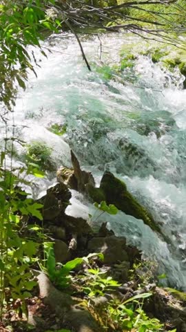 Rushing waterfall cascades at Plitvice Lakes National Park in Croatia
