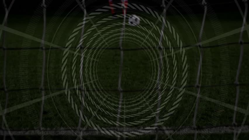 Shooter kicking soccer ball into net, with rotating overlay tracking ball as goalkeeper diving. Sport, athletic, action, vibrant, competitive, intensity, nighttime - Powered by Shutterstock - Get 15% off with code: PIKWIZARD15