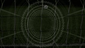 Shooter kicking soccer ball into net, with rotating overlay tracking ball as goalkeeper diving. Sport, athletic, action, vibrant, competitive, intensity, nighttime - Powered by Shutterstock - Get 15% off with code: PIKWIZARD15