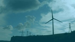 Data grid overlaying hill activating charts with rotating turbine blades visualizing performance. Renewable, sustainable, technology, analytics, digital, futuristic, environmental - Powered by Shutterstock - Get 15% off with code: PIKWIZARD15