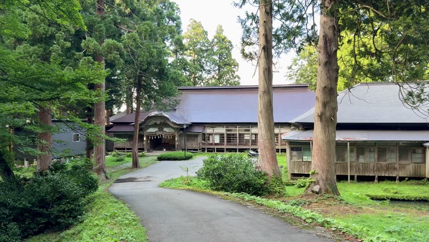 Stone steps leading to a Shinto shrine surrounded by cedar trees on Mt Haguro, Yamagata, Japan
