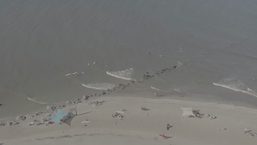 Beautiful 4K aerial drone footage showcasing luxurious waterfront homes on Hilton Head Island, South Carolina. The sweeping cinematic shot captures elegant coastal architecture surrounded by calm blue