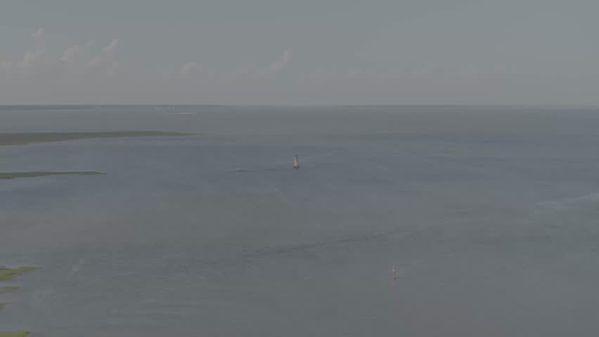 Beautiful 4K aerial drone footage showcasing luxurious waterfront homes on Hilton Head Island, South Carolina. The sweeping cinematic shot captures elegant coastal architecture surrounded by calm blue