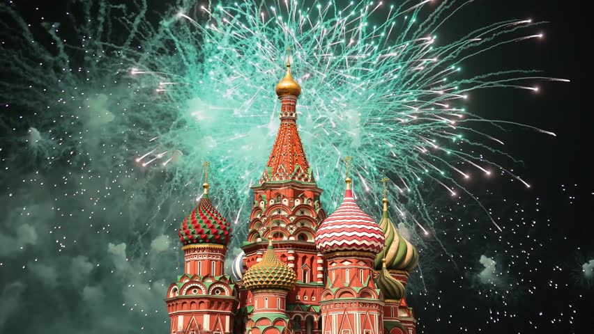 Temple of Basil the Blessed and fireworks in honor of Victory Day celebration (WWII), Red Square, Moscow, Russia. Time lapse
