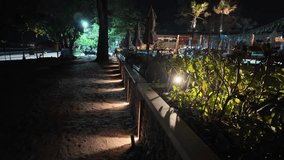 Tropical night lights near beach cafe - Powered by Shutterstock - Get 15% off with code: PIKWIZARD15
