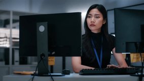 Focused on Programming Artificial Intelligence and Machine Learning Application, Professional Asian Female Software Developer Writing Code on Desktop Computer with Dual Screen sits at desk in office. - Powered by Shutterstock - Get 15% off with code: PIKWIZARD15
