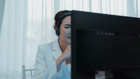 Businesswoman wearing headset working in office to support remote customer or colleague. Frustrated and tired call center customer support agent facing problem on providing vivancy service - Powered by Shutterstock - Get 15% off with code: PIKWIZARD15