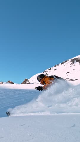 Off Piste Skier Running Down. Super Slow Motion, 1000 fps. Skiing on Free Ride off Piste Slope in European Dolomites Mountains, Italy. Vertical Aspect Ratio.