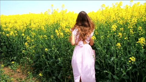 Female Model in Vintage Dress Running through Yellow Field Slow Motion HD