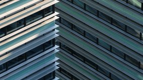Close-up architectural detail of a modern building facade featuring repeating horizontal lines, glass panels, and geometric symmetry in Vilnius, Lithuania. - Powered by Shutterstock - Get 15% off with code: PIKWIZARD15