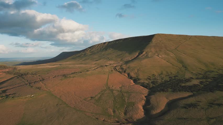 Aerial drone shot of Hay Bluff Mountain in Wales, UK, showcasing dramatic landscapes, rolling hills, and natural beauty from a breathtaking bird’s-eye view.