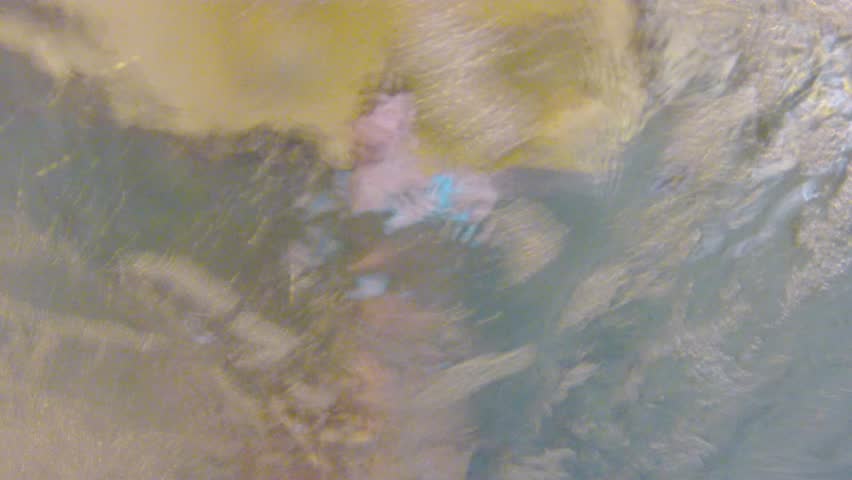 Underwater shot of hotel hot tub jets and bubbles.