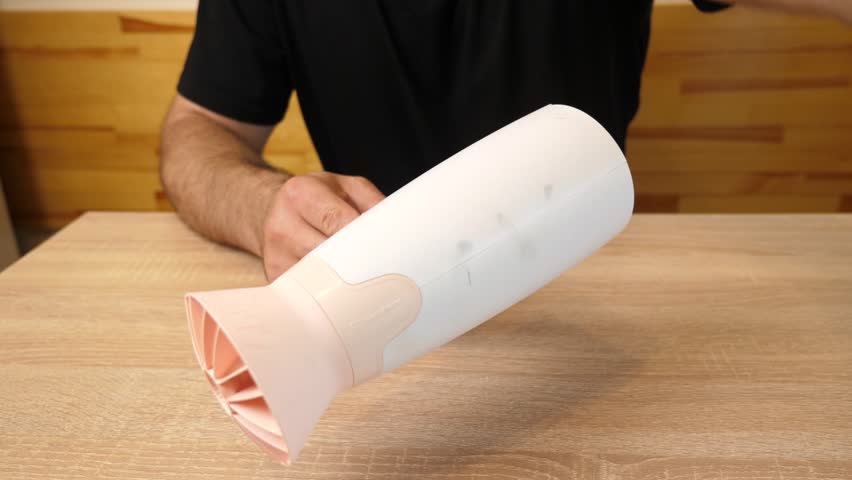 Checking the operation of the hair dryer for hair care.