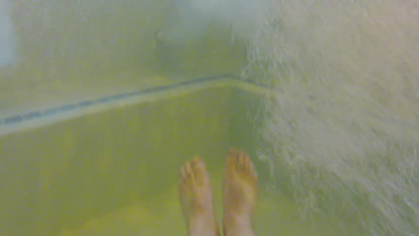 Underwater shot of people in a hotel hot tub
