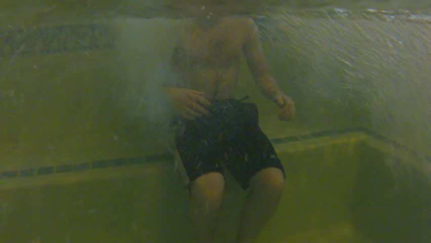 Underwater shot of people in a hotel hot tub