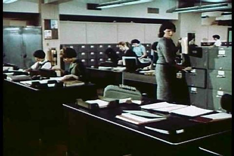 1950s - In 1950s offices, modern secretaries work for the phone company.
