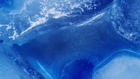Vertical video. Pour liquid. Ice texture. Defocused blue color shiny ink flowing water drop floating on abstract frost light art background. - Powered by Shutterstock - Get 15% off with code: PIKWIZARD15