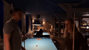 Happy middle-aged couple playing billiards together, celebrating successful shot with high five and hug. Concept of love, fun, active lifestyle, leisure, sport for adults. - Powered by Shutterstock - Get 15% off with code: PIKWIZARD15