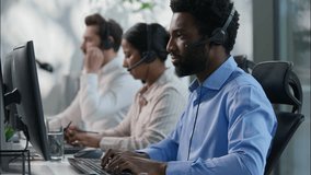 Multinational team African male callcenter operators thumbs up headset smiling office computer support female Indian coworker typing customer service happy Caucasian colleague job call center business - Powered by Shutterstock - Get 15% off with code: PIKWIZARD15