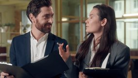 Multiethnic happy businesspeople coworkers discuss reports documents at office Caucasian businessman Korean businesswoman partners managers laughing success finance startup showing clipboard talking - Powered by Shutterstock - Get 15% off with code: PIKWIZARD15