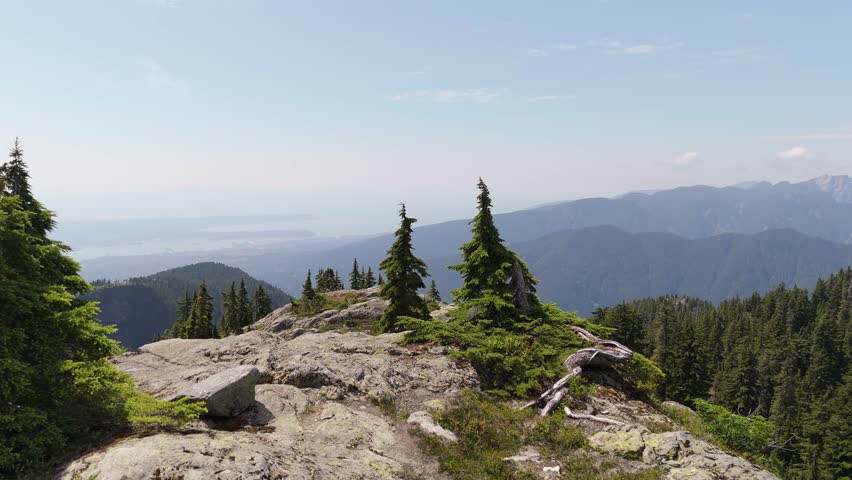 Panoramic Mountain Vista in North Vancouver, British Columbia, Revealing Breathtaking Natural Beauty and Distant Cityscapes