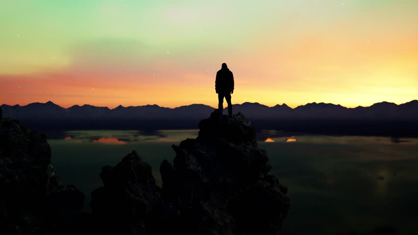 Epic Aurora Display Over a Serene Landscape with a Lone Figure on a Mountain Peak