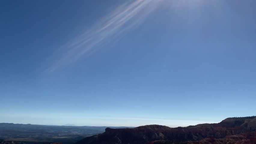 Bryce Canyon National Park in Utah. Hoodoos in giant natural amphitheaters along Paunsaugunt Plateau. Tree with exposed roots along Rim Trail.