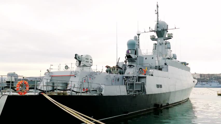 Modern missile boat docked at the quay wall, symbolizing naval defense, maritime technology, and modern military power at sea.