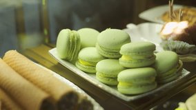 Pastry Showcase: A delightful array of pastel-colored macarons and other delectable pastries. The delicate treats are displayed attractively, promising a symphony of flavors and textures. - Powered by Shutterstock - Get 15% off with code: PIKWIZARD15