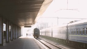 Railway Platform Serenity: Capturing a serene railway station with a departing train, highlighting the architecture and the sense of journey. The image evokes a feeling of travel and transition. - Powered by Shutterstock - Get 15% off with code: PIKWIZARD15