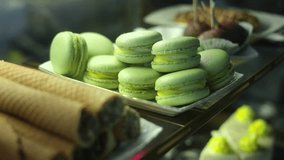 Pastry Showcase: A delightful array of pastel-colored macarons and other delectable pastries. The delicate treats are displayed attractively, promising a symphony of flavors and textures. - Powered by Shutterstock - Get 15% off with code: PIKWIZARD15