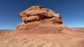 Woman hiking at Beehive and New Wave trails in Glen Canyon National Recreation Area near Page, Arizona. Sandstone outcroppings, windswept rock formations, desert landscape. - Powered by Shutterstock - Get 15% off with code: PIKWIZARD15