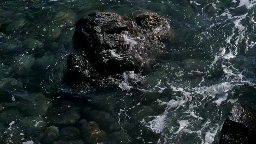 Rock ocean waves Ocean waves crashing intensely over rocky shoreline. Vertical video