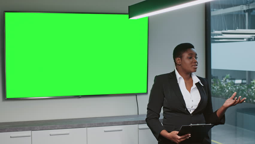 Young African American woman leading a corporate presentation