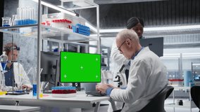 Isolated mockup on monitor next to diverse team in chemistry lab focuses on molecular science, conducting laboratory experiments in biotechnology and genetics research. Medical solutions. Camera A. - Powered by Shutterstock - Get 15% off with code: PIKWIZARD15
