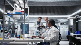 African american scientist placing tray under the microscope, slides matter for molecular and genetics research. Optics, diagnostics and analysis with advanced equipment for biochemistry. Camera A. - Powered by Shutterstock - Get 15% off with code: PIKWIZARD15