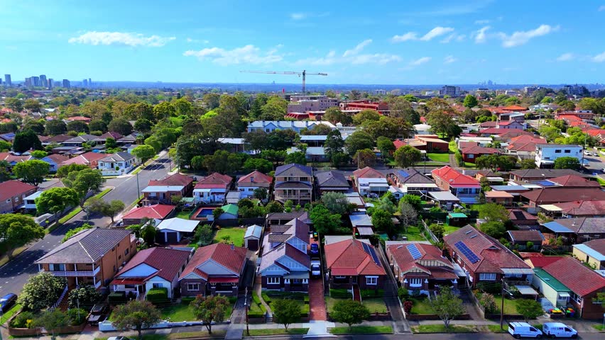Aerial Drone view of Sydney Inner West Sydney Suburb of Ashbury and Croydon with house roof tops, the streets parks and cars in Sydney NSW Australia