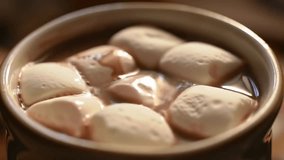Close-up of delicious hot chocolate with sweet marshmallows slowly melting, evoking warmth and comfort. Perfect for winter, holiday, or dessert ads. - Powered by Shutterstock - Get 15% off with code: PIKWIZARD15