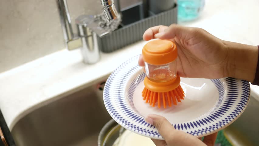 Efficiently washing dishes with a new gadget near the sink